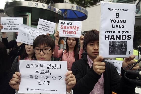 South Korean protesters stage a rally urging China to stop repatriating North Korean defectors in front of the Foreign Ministry in Seoul.