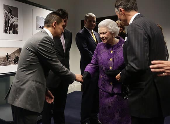 Queen Elizabeth II meeting Nepalese Sherpa mountain climber Jamling Norgay, left, son of Tenzing Norgay, during a reception to celebrate the 60th Anniversary of the ascent of Everest, at the Royal Geographical Society in Kensington, west London.