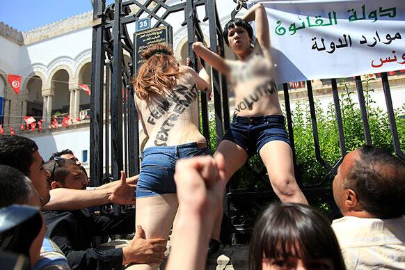 Activists from the women`s movement FEMEN are appreheded while staging a protest against the jailing of a Tunisian member in Tunis, Tunisia.
