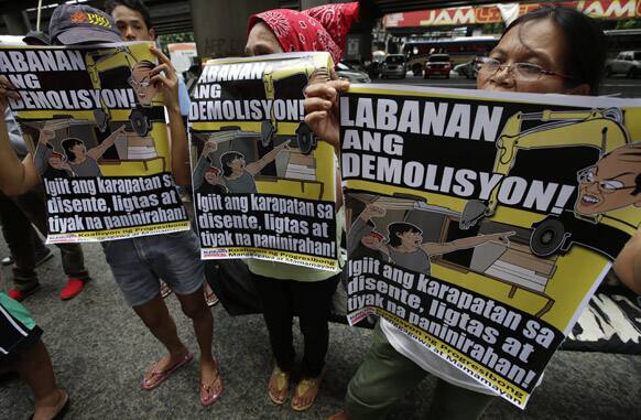 Protesters, mostly informal settlers, picket the Interior and Local Government office in suburban Quezon city northeast of Manila.
