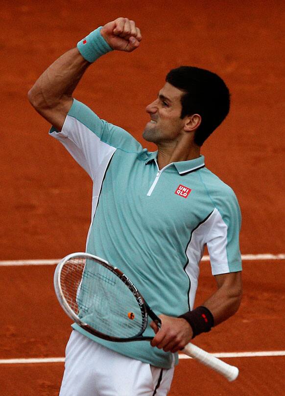 Serbia`s Novak Djokovic reacts as he defeats Belgium`s David Goffin during their first round match of the French Open tennis tournament.
