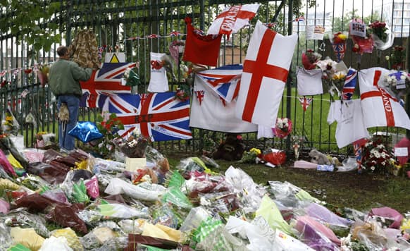 Some of the thousands of floral and other tributes left at the scene near Woolwich Barracks in London, where 25-year-old soldier of the Royal Regiment of Fusiliers Lee Rigby was attacked and killed last week.