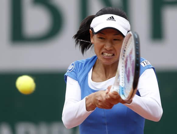 Japan`s Kimiko Date-Krumm returns the ball to Australia`s Samantha Stosur during their first round match of the French Open tennis tournament at the Roland Garros stadium in Paris.