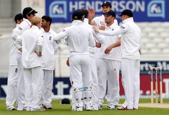 England`s Jonathan Trott celebrates with his teammates after catching out New Zealand`s Tim Southee on the fifth day of the second Test match between England and New Zealand at Headingley cricket ground in Leeds, England.