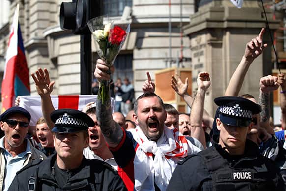 English Defence League supporters protest outside Downing Street in London in support of the British armed forces, after the brutal killing of an off-duty British soldier in a London street.