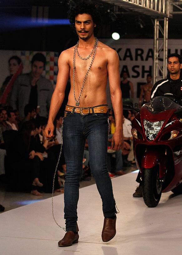 A Pakistani model presents a creation by designer Element Jeans, during Men`s Fashion Week in Karachi.