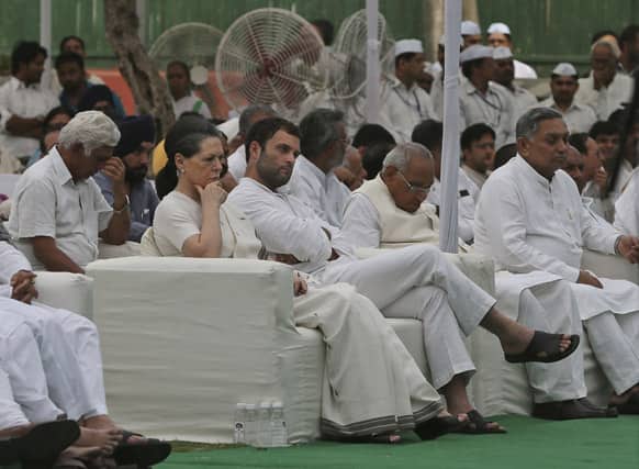 India`s Congress party president Sonia Gandhi and vice president Rahul Gandhi sit at a prayer meeting held at the party`s headquarters to pay tribute to those killed in Saturday`s Maoist attack in Chhattisgarh in New Delhi.