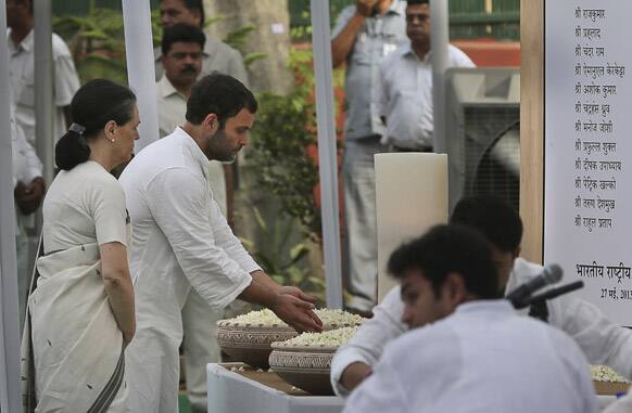 India`s Congress party president Sonia Gandhi and vice president Rahul Gandhi pay tribute to those killed in Saturday`s Maoist attack in Chhattisgarh at a prayer meeting held at the party`s headquarters in New Delhi.