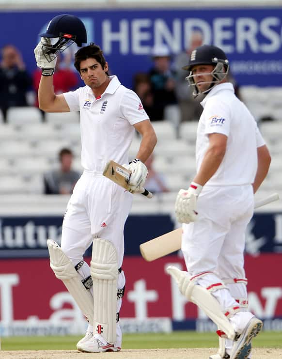 England`s captain Alastair Cook celebrates after scoring a century with Jonathan Trott during the fourth day of the second Test match between England and New Zealand at Headingley cricket ground in Leeds, England.