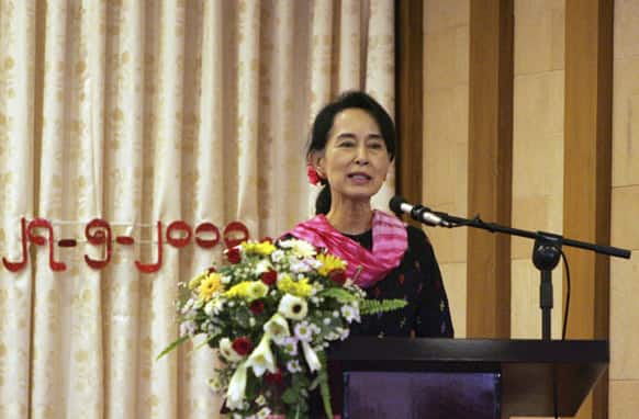 Myanmar Opposition Leader Aung San Suu Kyi speaks during Central Executive Committee (CEC) meeting of her National League for Democracy party at a restaurant in Yangon, Myanmar.