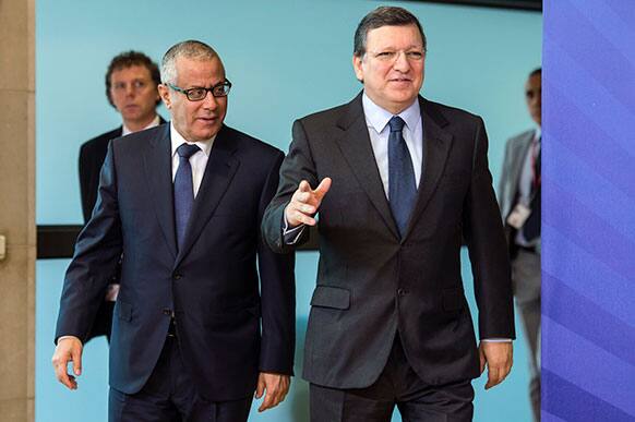 European Commission President Jose Manuel Barroso, right, walks with Libyan Prime Minister Ali Zeidan at the European Commission headquarters in Brussels.