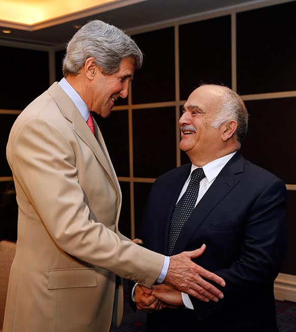 US Secretary of State John Kerry, left, meets with Jordan`s Prince El Hassan bin Talal in Amman, Jordan.