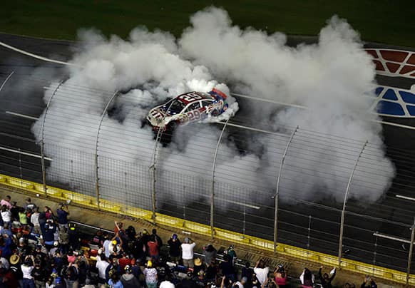 Kevin Harvick (29) does a burnout after winning the NASCAR Sprint Cup Series Coca-Cola 600 auto race at the Charlotte Motor Speedway in Concord, N.C.