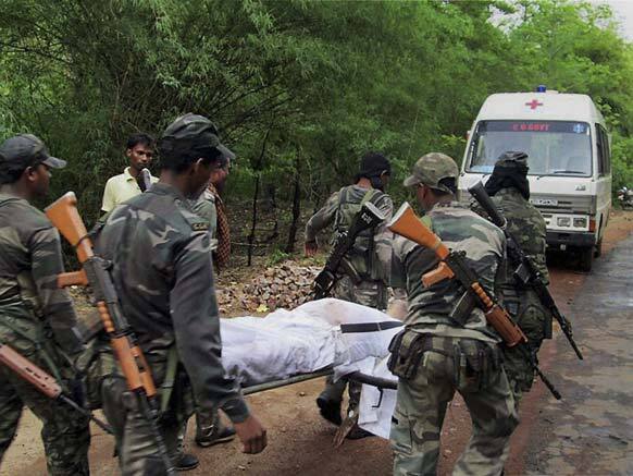 Security personnel carry the body of one of the victims of Saturday’s Maoist attack in a densely forested area in Bastar, about 345 kilometers (215 miles) south of Raipur, Chhattisgarh state.