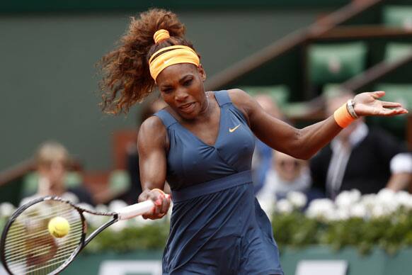 Serena Williams, of the USA, returns the ball to Georgia`s Anna Tatishvili during their first round match of the French Open tennis tournament at the Roland Garros stadium.