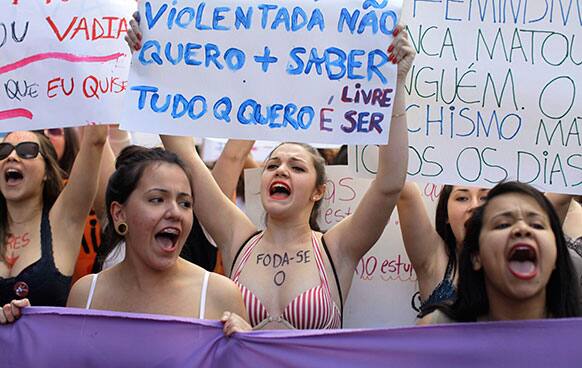 Women chant slogans as they march in a