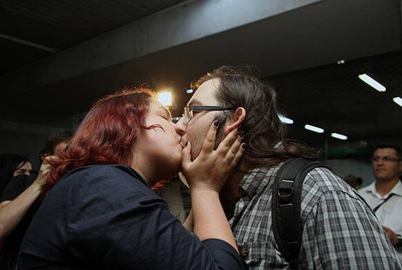 A young Turkish couple kiss to protest against subway official`s harassment of a couple for kissing in public last week, inside a subway stop in Ankara, Turkey.