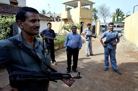 FILE – Mahendra Karma, center, lawmaker and founder of Salwa Judum, the government-supported militia to combat Communist rebels known as Naxalites, is surrounded by bodyguards at his residence in Jagdalpur, in the central Indian state of Chattisgarh.