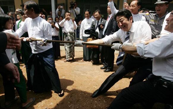 Japanese Prime Minister Shinzo Abet, plays tug-of-war with Myanmar school children at Lat Yat San Friends Elementary School in Yangon, Myanmar.