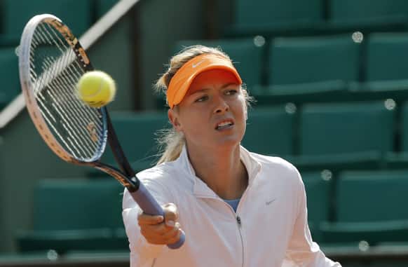 Russia`s Maria Sharapova returns the ball during a training session for the 2013 French Open tennis tournament, at Roland Garros stadium in Paris.