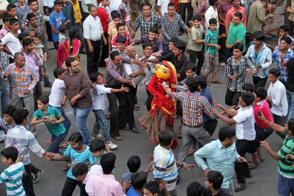 Men tease a character Nakti, the sister of demon Hiranyakashyap, as ritualistic celebrations to mark Narsingh Jayanti in Ajmer.