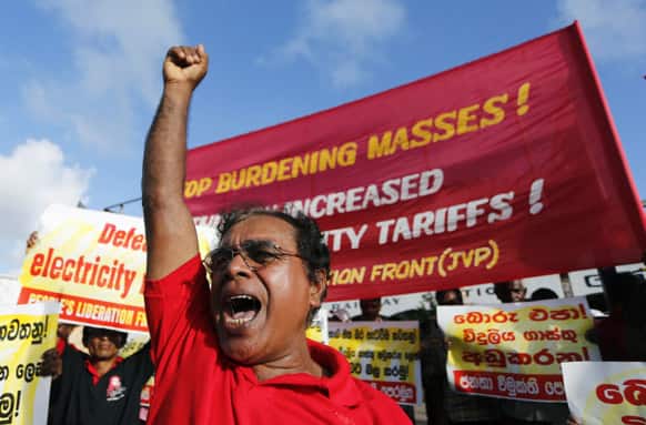 A People`s Liberation Front activist shouts slogans during a protest in Colombo, Sri Lanka. Hundreds of Marxist supporters protested against an increase in electricity charges and demanded an immediate reduction.