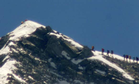 A team of climbers led by 80-year-old Japanese mountaineer Yuichiro Miura approach the summit of Mount Everest. Miura on Thursday became the oldest man to reach the top of Mount Everest.