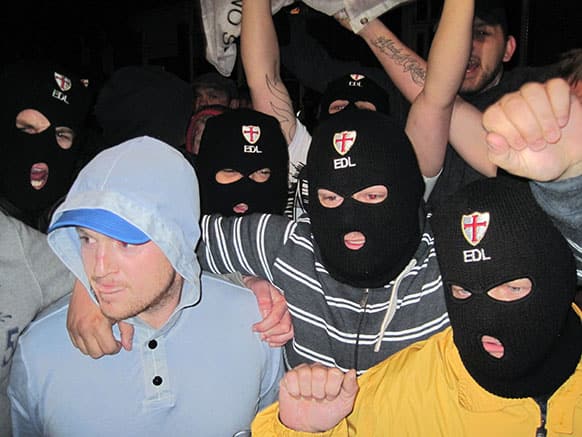 Far-right group, English Defence League leader, Tommy Robinson, left, with EDL supporters outside The Queens Arms public house in Woolwich, south east London, following the death of a man, believed to be a serving soldier, who was killed in broad daylight near the Royal Artillery Barracks in Woolwich.