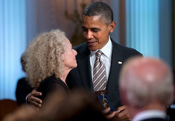 President Barack Obama presents the Library of Congress Gershwin Prize for Popular Song during an East Room concert honoring singer-songwriter Carole King at the White House in Washington.