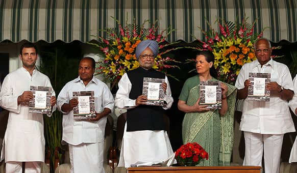 Manmohan Singh, Sonia Gandhi, A.K. Antony, Sharad Pawar, and Rahul Gandhi display the ‘Report to the People’, a self-assessment report, during a function to celebrate the completion of four years of UPA’s second term in power, in New Delhi.