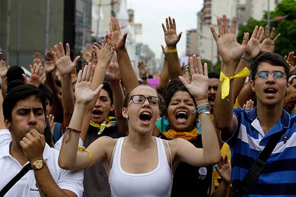 Public university students shout slogans against Venezuela`s President Nicolas Maduro during a protest in Caracas, Venezuela.