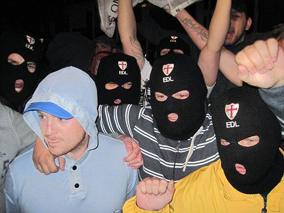 Far-right group, English Defence League leader, Tommy Robinson, left, with EDL supporters outside The Queens Arms public house in Woolwich, south east London, following the death of a man, believed to be a serving soldier, who was killed in broad daylight near the Royal Artillery Barracks in Woolwich.