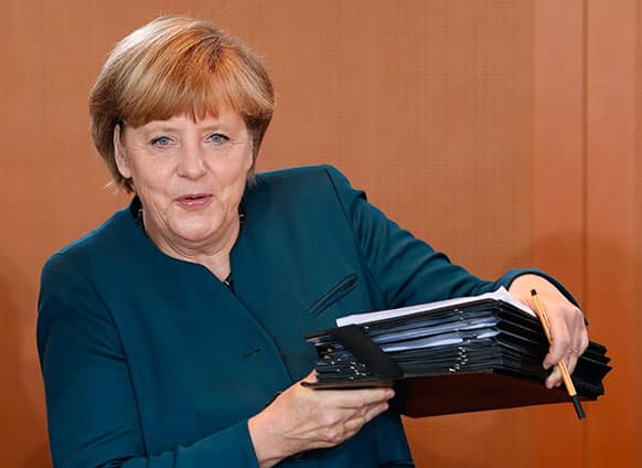 German Chancellor Angela Merkel arrives for the weekly cabinet meeting at the chancellery, in Berlin.