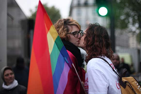 People kissing one another attend the event