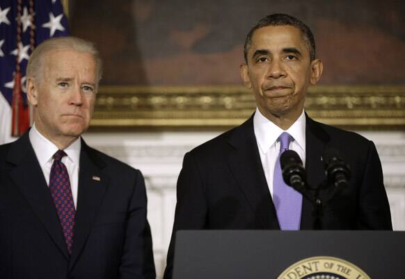 President Barack Obama accompanied by Vice President Joe Biden, talks about the Oklahoma tornado and severe weather, in the State Dining Room of the White House in Washington.