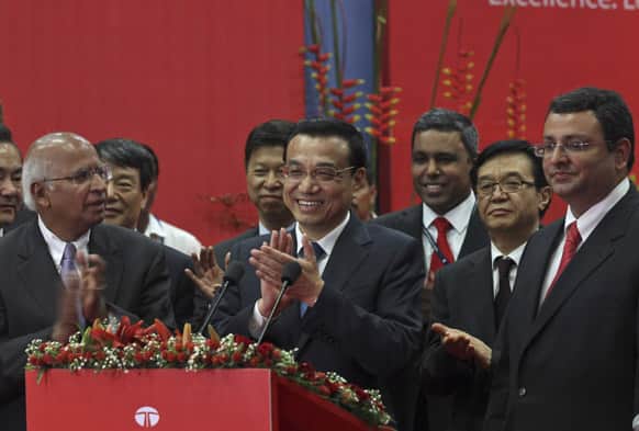Chinese Premier Li Keqiang, applauds at an interaction with the media during his visit to the Tata Consultancy Services office in Mumbai. Li told Indian business leaders Tuesday that developing stronger economic ties between their two nations would have huge benefits for both sides.