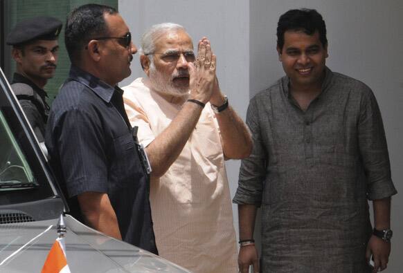 Gujarat state Chief Minister Narendra Modi, greets as he arrives to attend the Bharatiya Janata Party (BJP) Parliamentary board meeting in New Delhi.