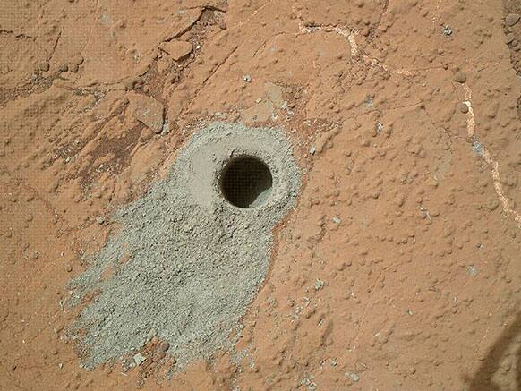 This image released by NASA shows a hole in a Martian rock drilled by the NASA rover Curiosity on May 19. It’s the second drilling by the spacecraft since landing in August 2012.