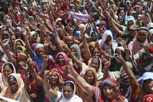 Health workers of Gujarat state, locally known as ‘Link Workers’ shout slogans during a protest in Ahmedabad.