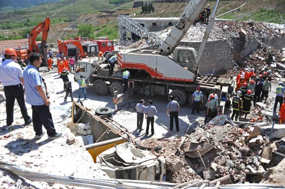 Rescuers work at the site where a blast ripped through an explosives manufacturing plant in Caofan Township of Zhangqiu City, east China`s Shandong Province.