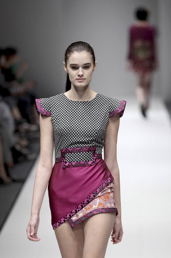 A model displays an outfit by Singaporean designer Ong Shunmugam during the annual Fashion Festival in Singapore.