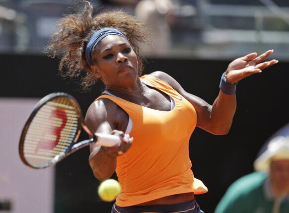 Serena Williams returns the ball to Romania`s Simona Halep during their semi final match at the Italian Open tennis tournament in Rome.