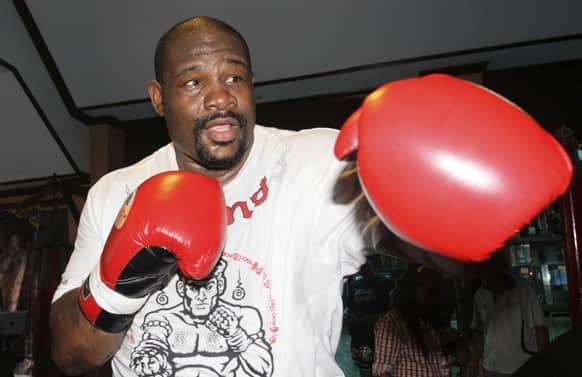 Former heavyweight boxing champion Riddick Bowe of the United States throws a punch during a sparring in Bangkok.
