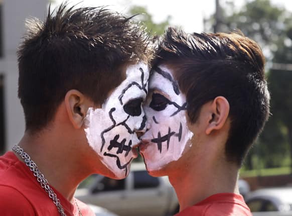Two men kiss during a protest against discrimination of same sex couples, marking International Day Against Homophobia, in Asuncion, Paraguay.