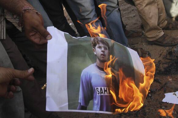 Cricket fans burn a picture of Shanthakumaran Sreesanth at a protest during the IPL in Ahmadabad. Police arrested three Indian cricketers, including Sreesanth, over allegations of spot-fixing, involving performing in a pre-determined way at set times for the benefit of gamblers, during a domestic Twenty20 game.