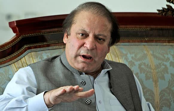 Nawaz Sharif, gestures while speaking to members of the media at his residence in Lahore, Pakistan. Over a decade ago, the man now set to become Pakistan°?s next prime minister stood at this border crossing with archenemy India to inaugurate a