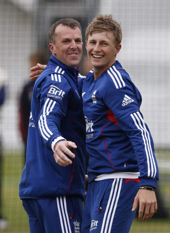 England`s Graeme Swann and Joe Root react as they train during a practice session at Lord`s cricket ground in London. England play New Zealand in the first Test cricket match starting Thursday.