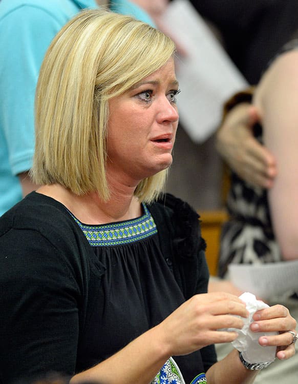 Stephanie Wardrip of Danville, Ky. fights back tears during the memorial service remembering the 25th anniversary of the Carrolton bus crash at North Hardin High School in Radcliff, Ky.