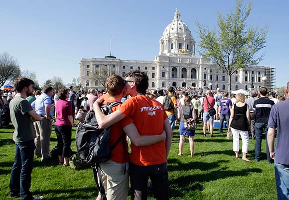 A crowd gathers at the State Capitol where Minnesota Gov. Mark Dayton signed the gay marriage bill, in St. Paul, Minn.