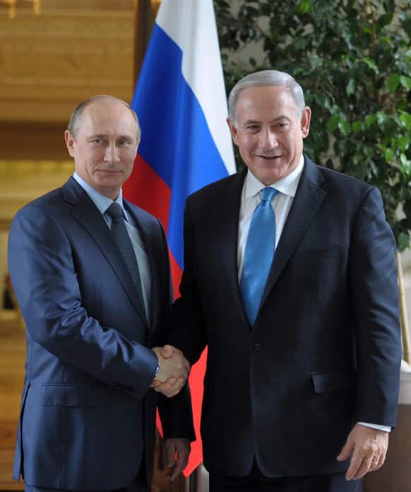 Russian President Vladimir Putin, left, shakes hands with Israeli Prime Minister Benjamin Netanyahu during their meeting at the Bocharov Ruchei residence in the Black Sea resort of Sochi, Russia.